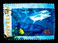 A stamp printed in Australia shows an image of Giant trevally fish on value at 45 cent.